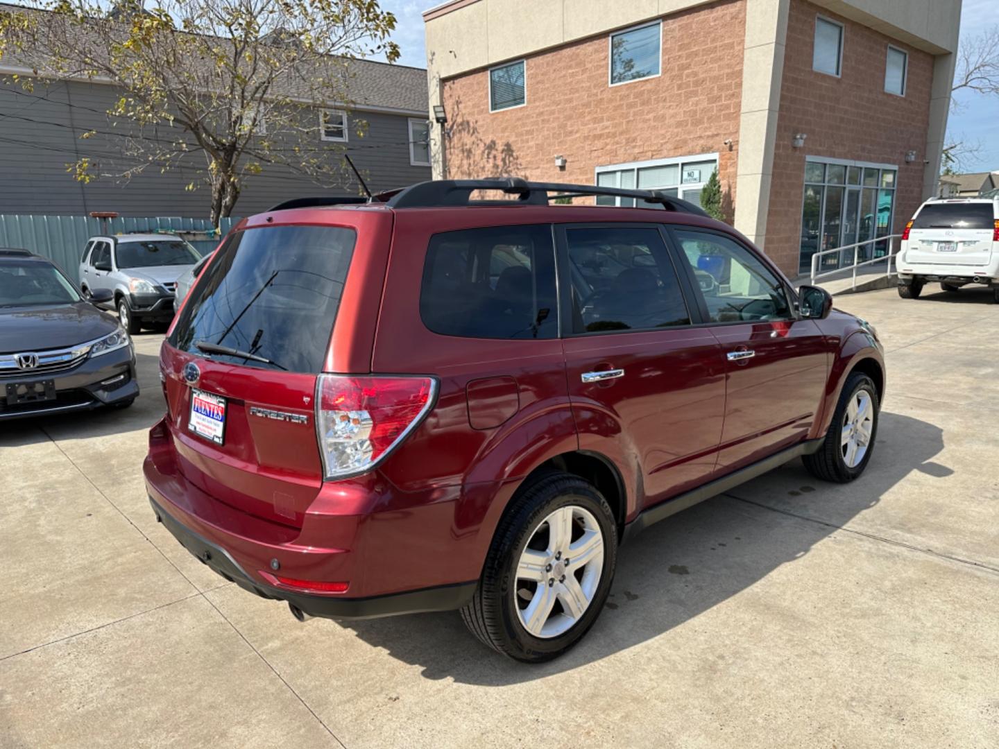 2009 Red /Black Subaru Forester X Limited (JF2SH64619H) with an 2.5 engine, Automatic transmission, located at 1501 West 15th St., Houston, 77008, (713) 869-2925, 29.797941, -95.411789 - Photo#2